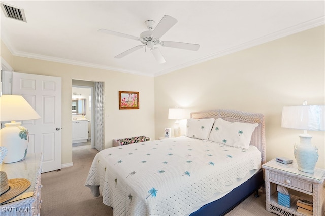 bedroom with carpet floors, crown molding, visible vents, a ceiling fan, and connected bathroom