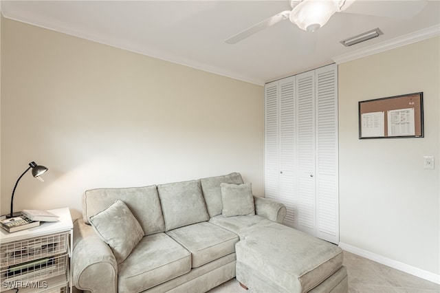 living room with baseboards, visible vents, ornamental molding, and a ceiling fan