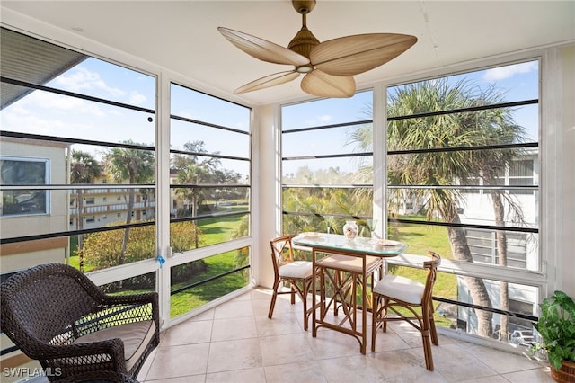 sunroom featuring a ceiling fan