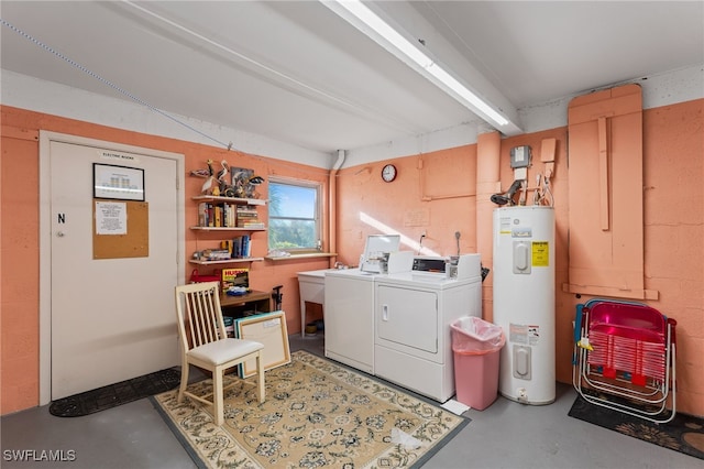 clothes washing area featuring washer and clothes dryer and electric water heater