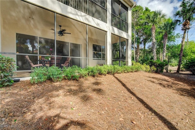 view of side of home with stucco siding