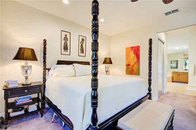 bedroom with baseboards, visible vents, connected bathroom, and recessed lighting