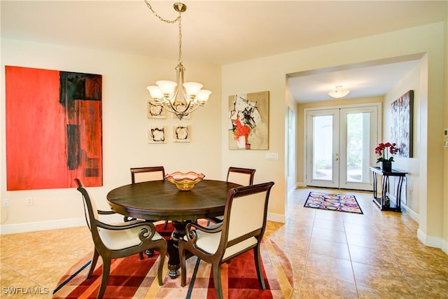 dining space with a chandelier, french doors, baseboards, and light tile patterned floors