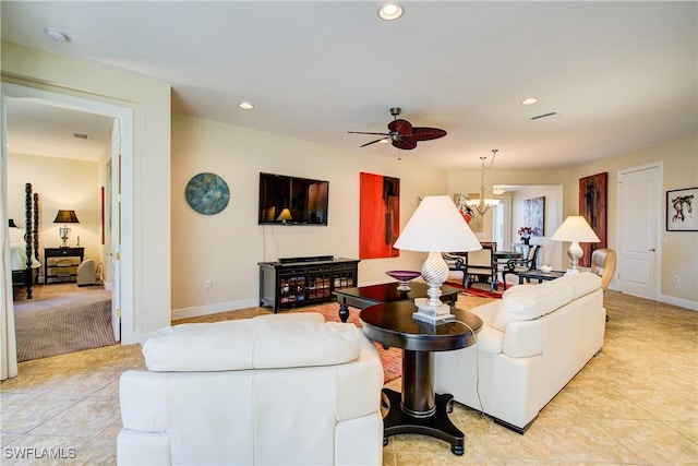 living area with visible vents, ceiling fan with notable chandelier, baseboards, and recessed lighting