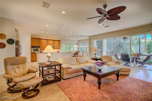 living room featuring ceiling fan, light tile patterned flooring, visible vents, and recessed lighting