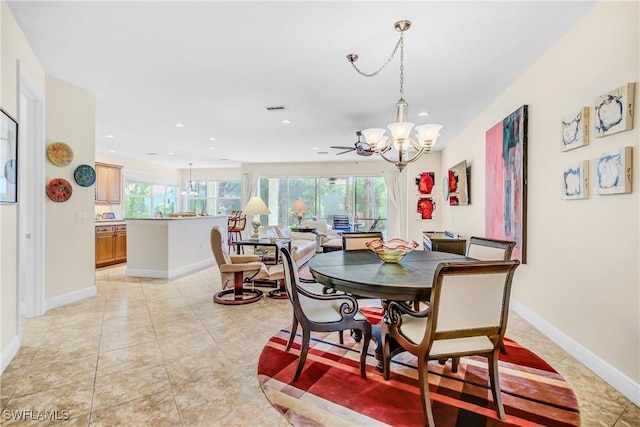 dining room with a healthy amount of sunlight, visible vents, a notable chandelier, and baseboards