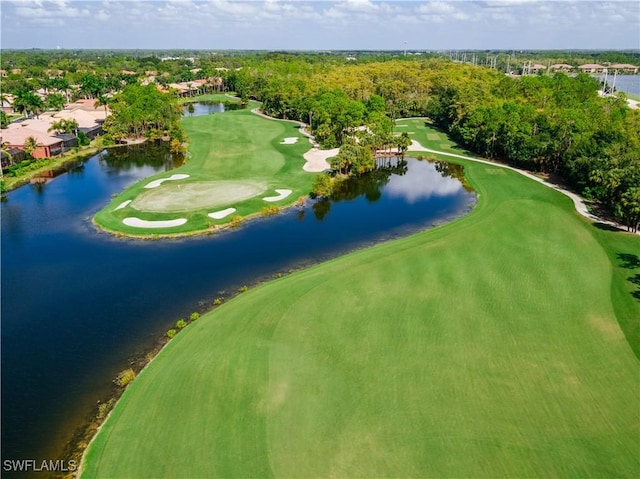 birds eye view of property featuring view of golf course and a water view