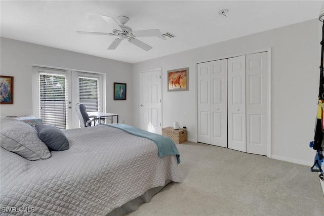 bedroom with light carpet, a ceiling fan, visible vents, baseboards, and a closet