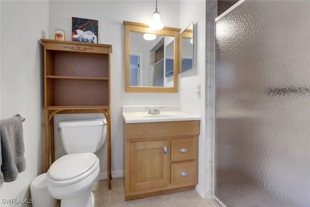 full bath featuring toilet, tile patterned flooring, a shower stall, and vanity