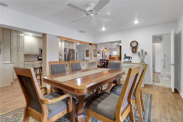 dining area with a ceiling fan, recessed lighting, visible vents, and light wood finished floors