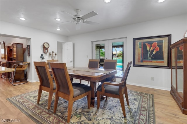 dining area featuring light wood-type flooring, recessed lighting, baseboards, and french doors