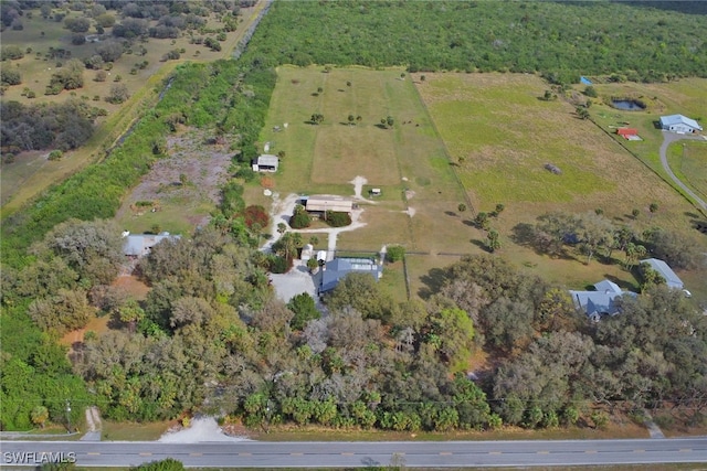 birds eye view of property with a rural view