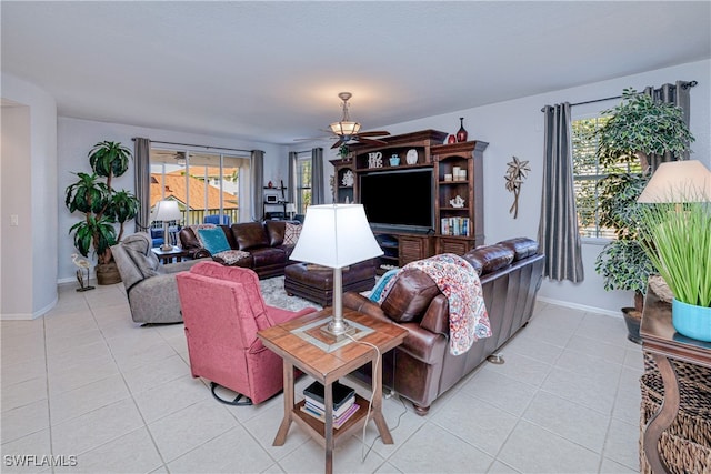 living room with baseboards and light tile patterned floors