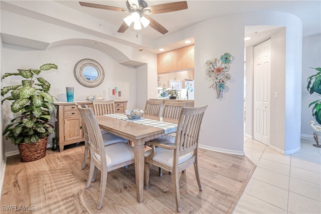 dining space featuring a ceiling fan, light wood-type flooring, baseboards, and recessed lighting