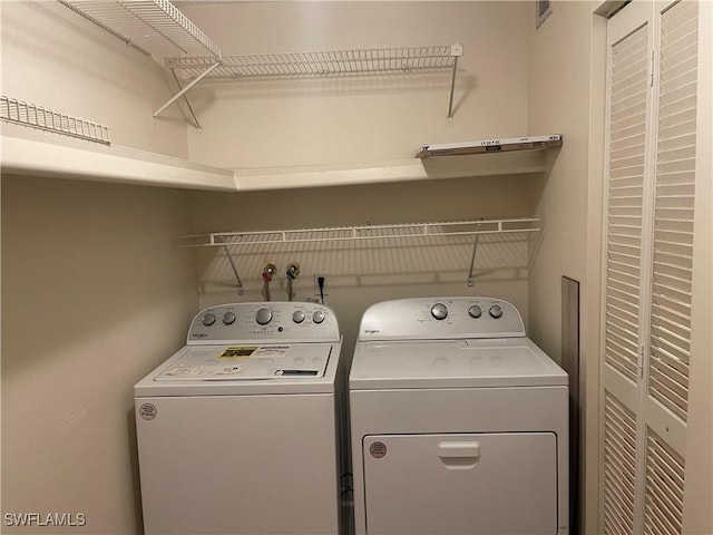 laundry area featuring laundry area and washer and dryer