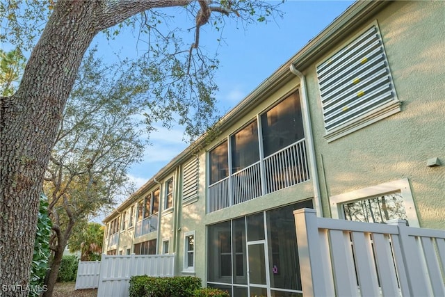 view of building exterior featuring fence