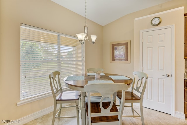 dining space featuring lofted ceiling, light tile patterned floors, baseboards, and an inviting chandelier