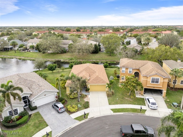 birds eye view of property with a residential view and a water view