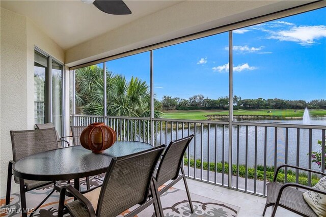 22810 Sago Pointe Dr Unit 2403, Estero, FL 34135 - sunroom with a water view, a textured wall, tile patterned flooring, and view of golf course