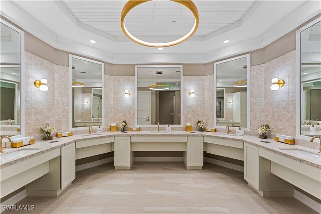 22810 Sago Pointe Dr Unit 2403, Estero, FL 34135 - bathroom featuring a raised ceiling, vanity, and wood ceiling