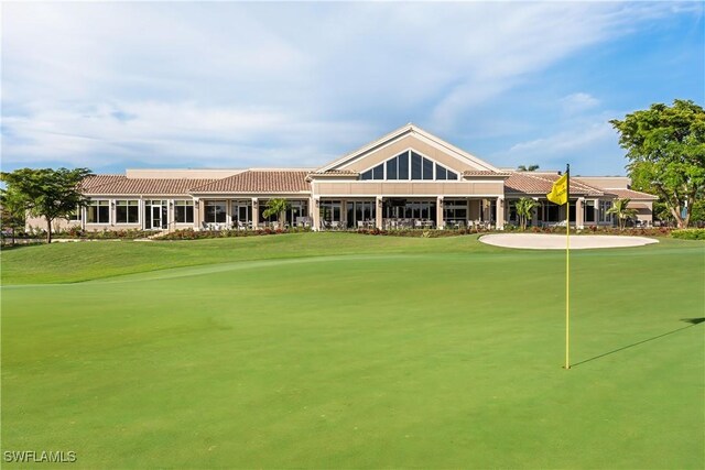 22810 Sago Pointe Dr Unit 2403, Estero, FL 34135 - surrounding community featuring a lawn, a putting green, and golf course view