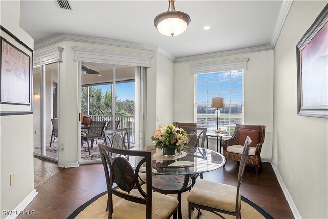 22810 Sago Pointe Dr Unit 2403, Estero, FL 34135 - dining area featuring healthy amount of natural light, wood finished floors, baseboards, and ornamental molding