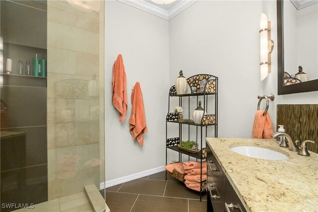 22810 Sago Pointe Dr Unit 2403, Estero, FL 34135 - bathroom with ornamental molding, vanity, tile patterned flooring, walk in shower, and baseboards