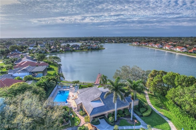 bird's eye view featuring a water view and a residential view