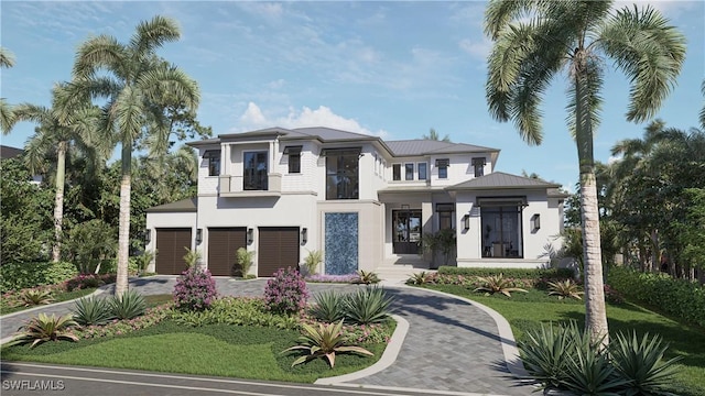 view of front of property featuring a front yard, decorative driveway, an attached garage, and stucco siding