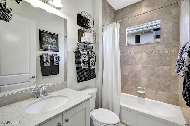 full bathroom with shower / bath combination with curtain, vanity, and toilet