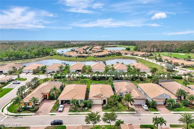 aerial view with a residential view and a water view