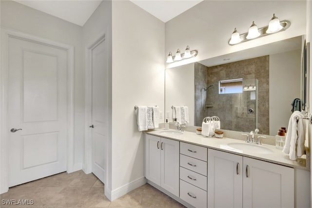 bathroom with tile patterned floors, double vanity, a sink, and walk in shower