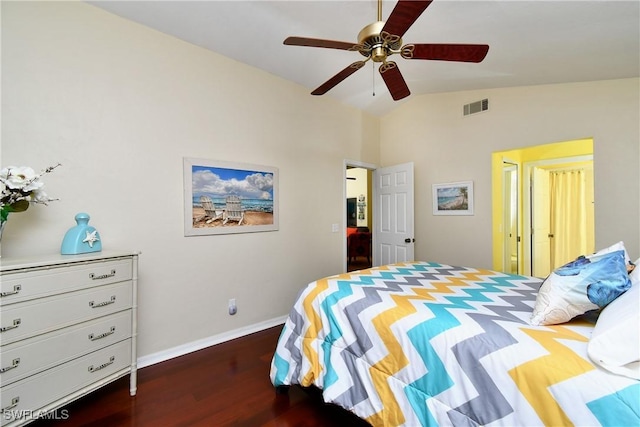 bedroom featuring lofted ceiling, visible vents, dark wood-type flooring, ceiling fan, and baseboards