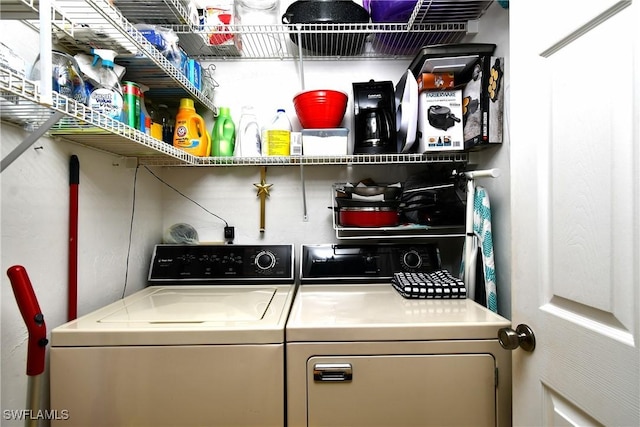 washroom with laundry area and separate washer and dryer