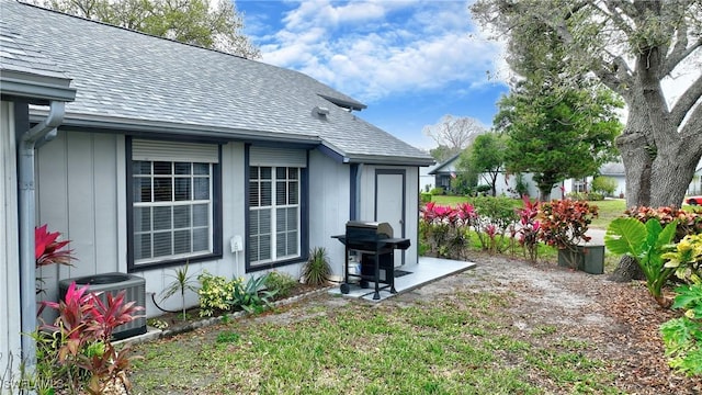 view of yard featuring central air condition unit and a patio