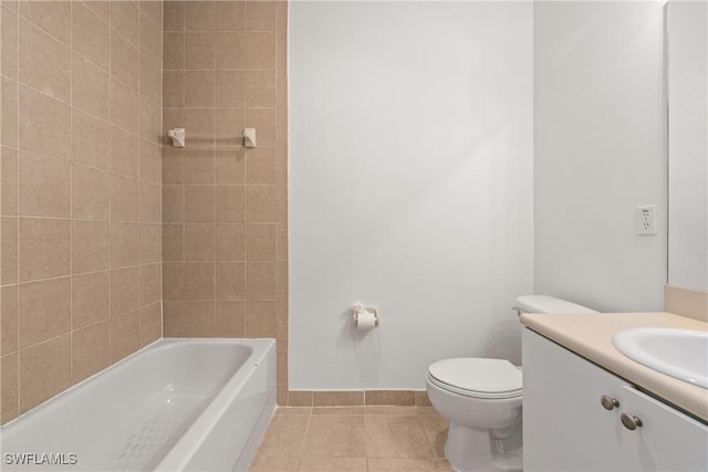 full bathroom featuring bathtub / shower combination, toilet, vanity, baseboards, and tile patterned floors