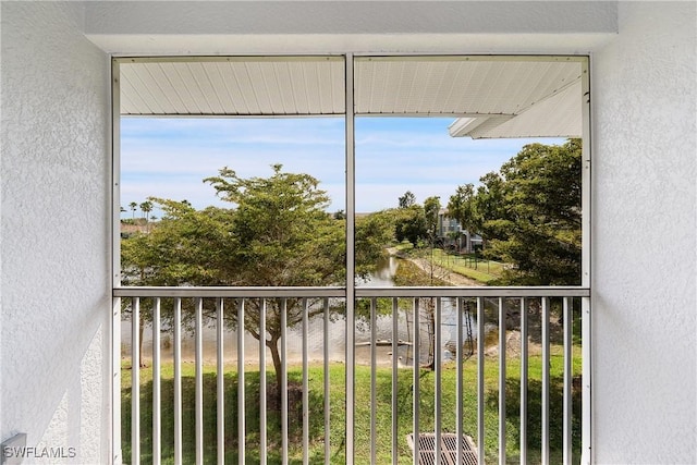 balcony featuring a water view