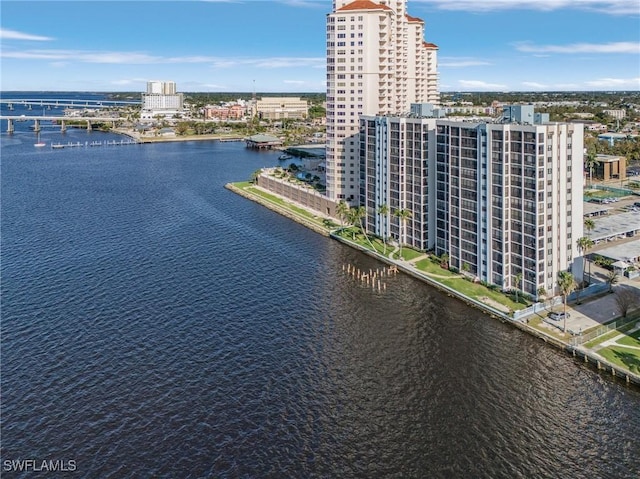 drone / aerial view with a view of city and a water view