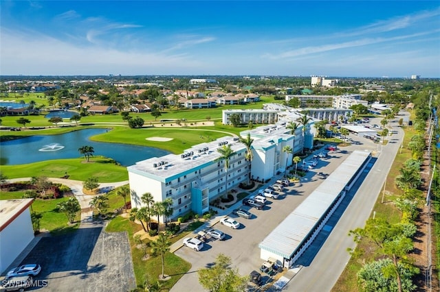 bird's eye view featuring a water view and golf course view