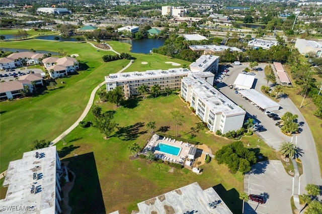 bird's eye view with view of golf course and a water view