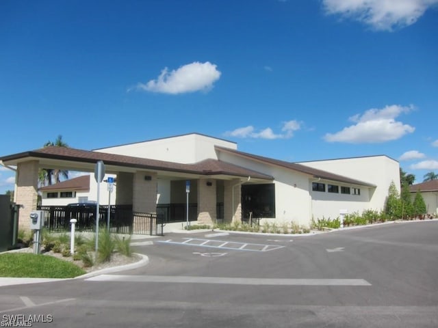 view of property with fence