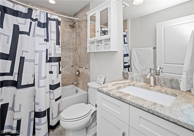 full bathroom with shower / tub combo, vanity, and toilet