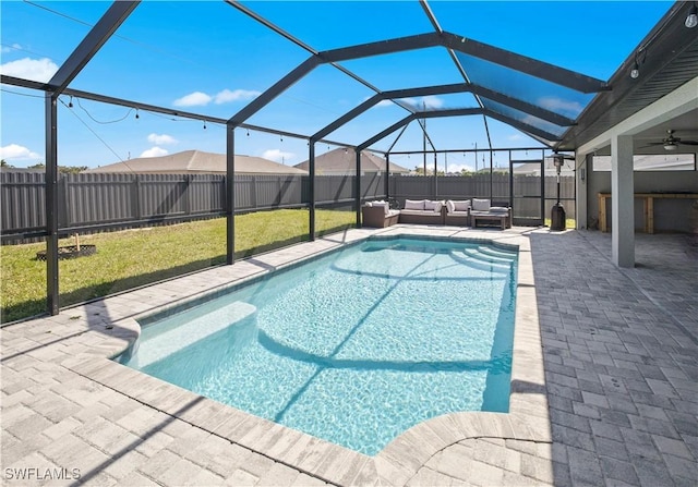 view of swimming pool with a fenced in pool, a patio, a fenced backyard, a lanai, and an outdoor living space