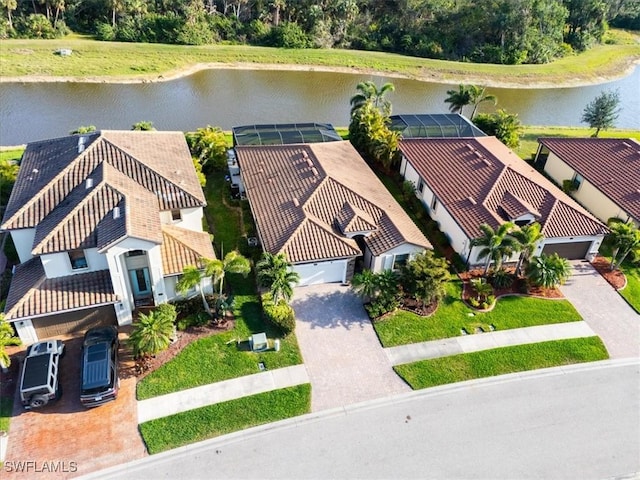 birds eye view of property with a residential view and a water view