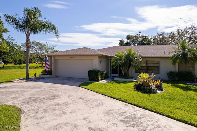 ranch-style house featuring a garage, driveway, a front lawn, and stucco siding