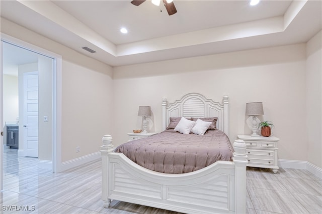 bedroom with recessed lighting, a ceiling fan, visible vents, baseboards, and a raised ceiling