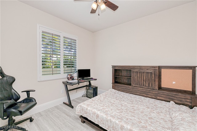 bedroom featuring a ceiling fan and baseboards