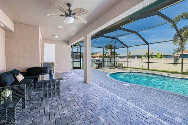 view of pool with a patio, a fenced backyard, a lanai, an outdoor living space, and a fenced in pool