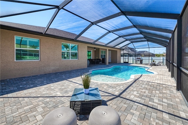 view of pool featuring a patio, a lanai, a fenced in pool, and fence