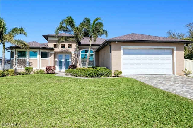 view of front of house with a garage, a front lawn, decorative driveway, and stucco siding